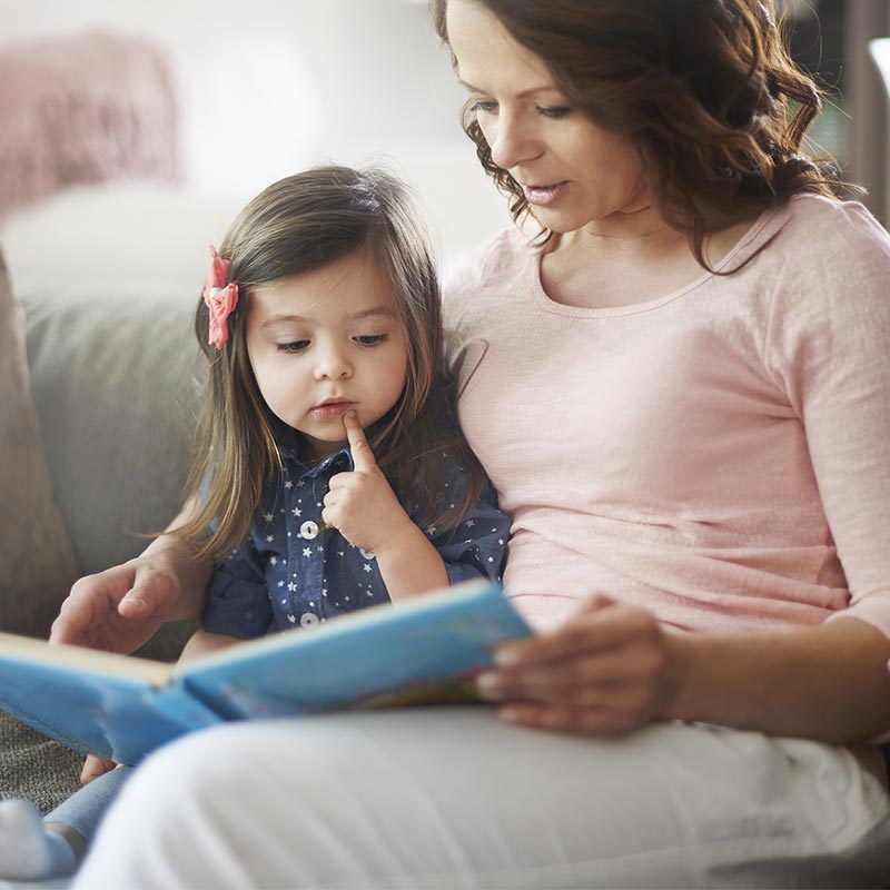 Mother reading with toddler