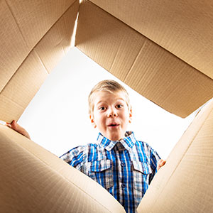Child opens their GroGro pack delivery.